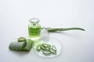 Aloe vera spa treatments on white wooden table photo