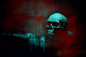 Skull skeleton with chain in red blood background photo