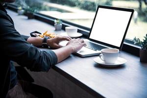 Side view of businessman using the laptop photo