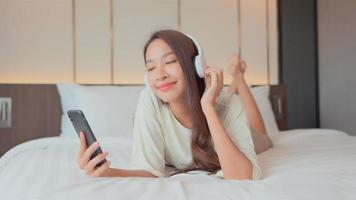 Woman use smart phone for listen music video