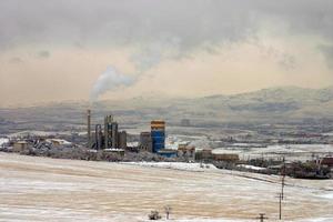 Snow landscape, a cement factory and industrial zone
