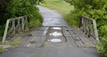 Wooden bridge over river photo