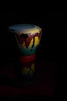 Percussion of African leather and ceramic on a black background
