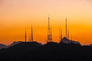 Silhouette of communication antennas on the Sumare hill, in Rio de Janeiro, Brazil
