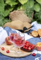 Set for picnic on blanket in lavender field photo