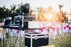 Mixing equalizer at outdoor in music party festival with dinner table photo
