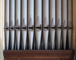 Pipes of a church pipe organ photo