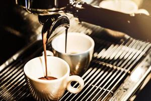 Espresso machine brewing a coffee photo