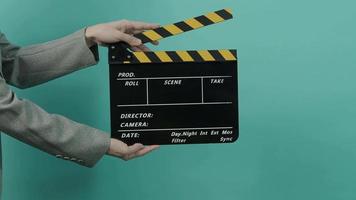 Movie slate or clapperboard hitting by Business woman video