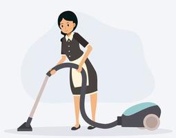 La criada está limpiando el piso por vacío.
