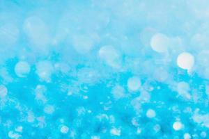 Defocused blue glitter background. blue abstract bokeh background. photo