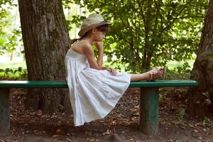 Little girl sitting in thought photo