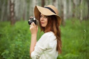 Beautiful girl with a camera photo