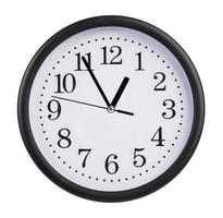 Office clock shows five minutes to an hour photo
