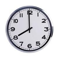 Round office clock shows eight o'clock photo