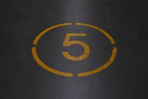 Number five is written with yellow paint photo