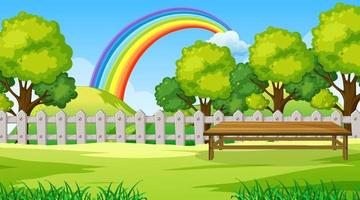 Park landscape scene with rainbow in the sky vector