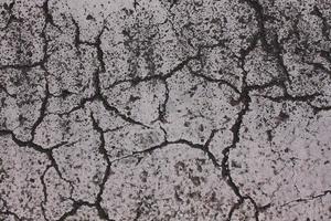 Asphalt road with many cracks photo