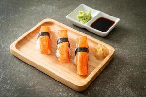 Crab Stick Sushi on wood plate photo