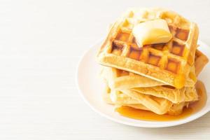 Waffle stack with butter and honey photo