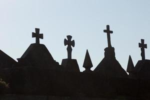 Silhouettes of crosses in a cemetery in Galicia, Spain.
