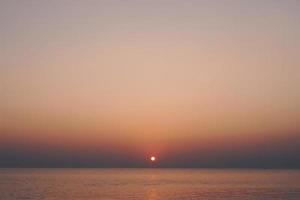 Tropical nature clean beach sunset sky time with sun light. photo