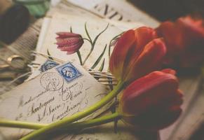 Red flowers with envelopes, vintage style photo