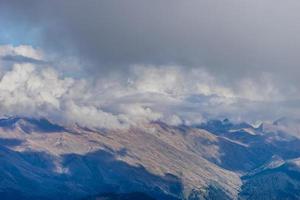 the top of the mountain on the background of the autumn sky photo