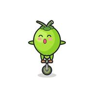 The cute coconut character is riding a circus bike vector