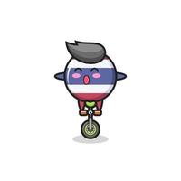The cute thailand flag badge character is riding a circus bike vector