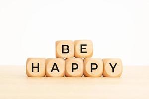 Be Happy phrase on wooden blocks. Copy space photo