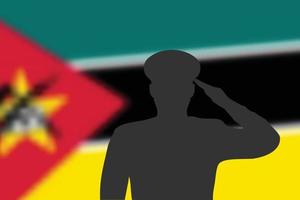 silueta de soldadura sobre fondo borroso con la bandera de mozambique. vector