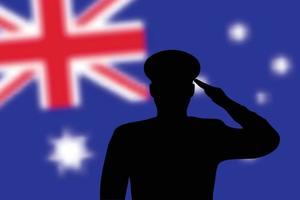 silueta de soldadura sobre fondo borroso con la bandera de australia. vector