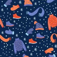 Vector seamless pattern with winter clothes on a dark blue.