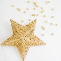 Golden star and small balls as Christmas decoration photo