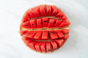 fresh watermelon sliced on plate photo