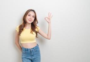 portrait beautiful woman with hand show ok or agree hand sign photo