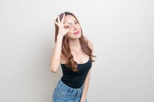 portrait beautiful woman with hand show ok or agree hand sign photo