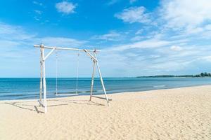 wooden swing on the beach