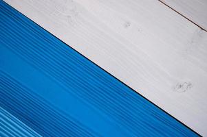 Top diagonal view of blue and white wooden textured background photo