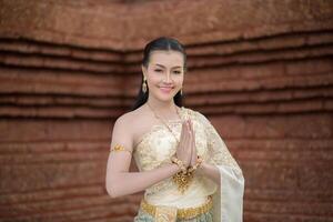 Beautiful Woman wearing typical Thai dress photo