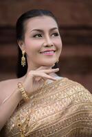 Beautiful Woman wearing typical Thai dress photo