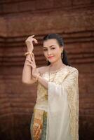 Beautiful Woman wearing typical Thai dress photo