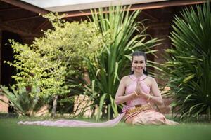 Beautiful Woman wearing typical Thai dress photo