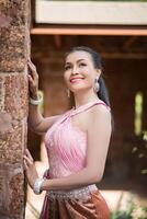 Beautiful Woman wearing typical Thai dress photo