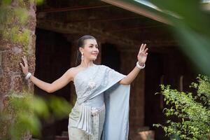 Beautiful Woman wearing typical Thai dress photo