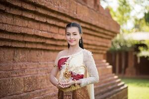 Beautiful Woman wearing typical Thai dress photo