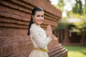 Beautiful Woman wearing typical Thai dress photo