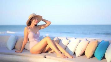Asian woman enjoys beautiful ocean beach