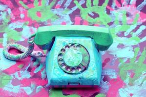 Vintage landline telephone with coiled cable photo